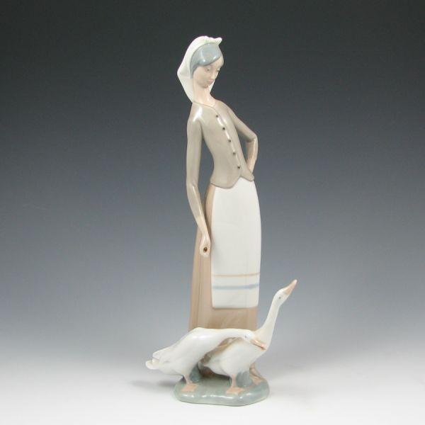 Appraisal: Retired Lladro figurine of a girl with geese Marked with