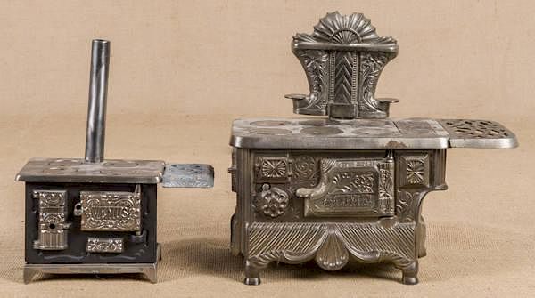 Appraisal: Two cast iron toy stoves one J E Stevens Co