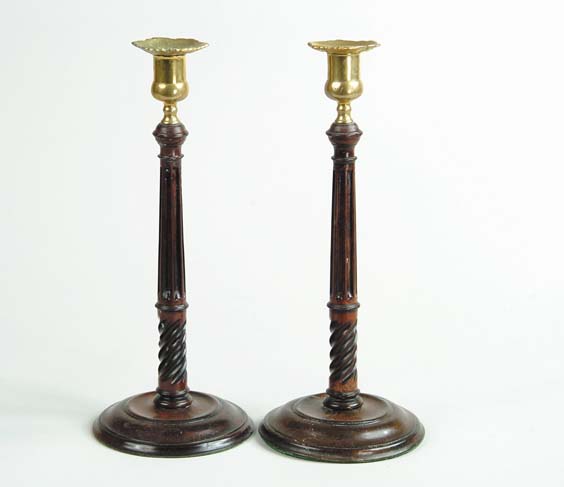 Appraisal: PAIR OF ENGLISH BRASS MOUNTED MAHOGANY TABLE CANDLESTICKS Each with