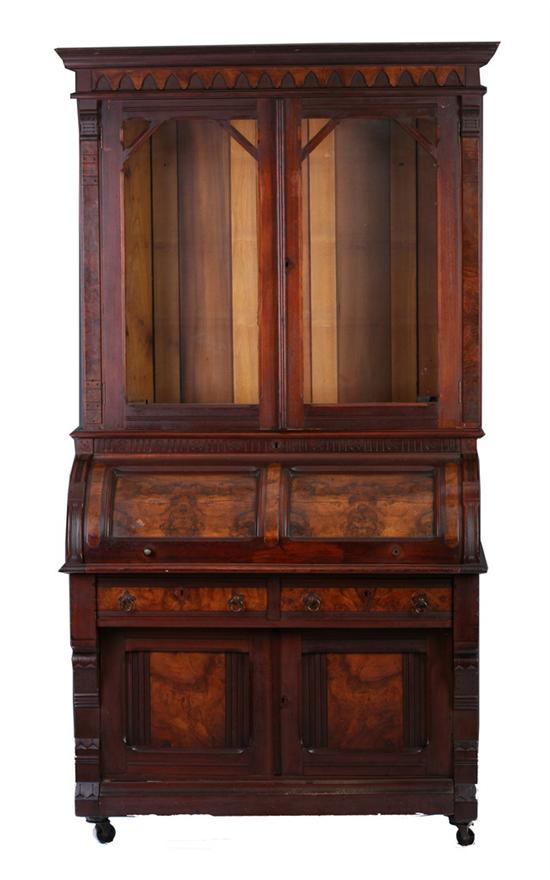 Appraisal: RENAISSANCE REVIVAL WALNUT SECRETARY BOOKCASE th century with paneled roll-top