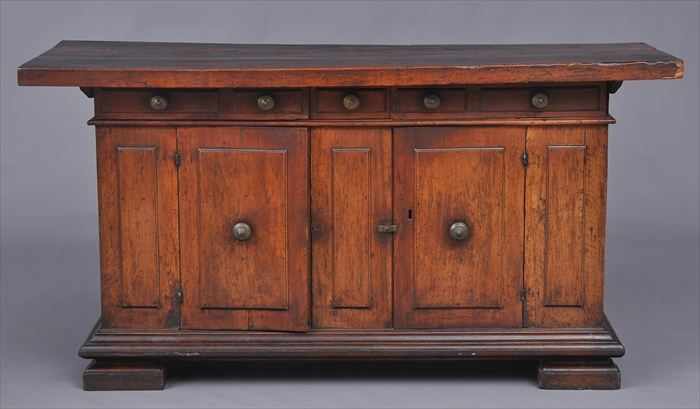 Appraisal: ITALIAN BAROQUE WALNUT SIDE CABINET With rectangular top the three