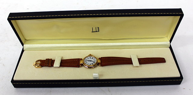 Appraisal: AN ALFRED DUNHILL LADIES GOLD PLATED WRISTWATCH with quartz movement