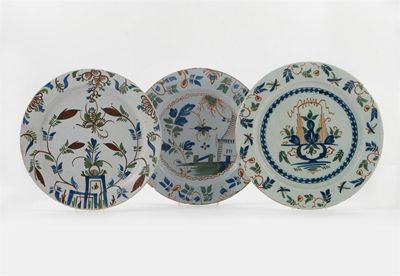 Appraisal: Three large delftware polychrome dishes decorated in shades of red