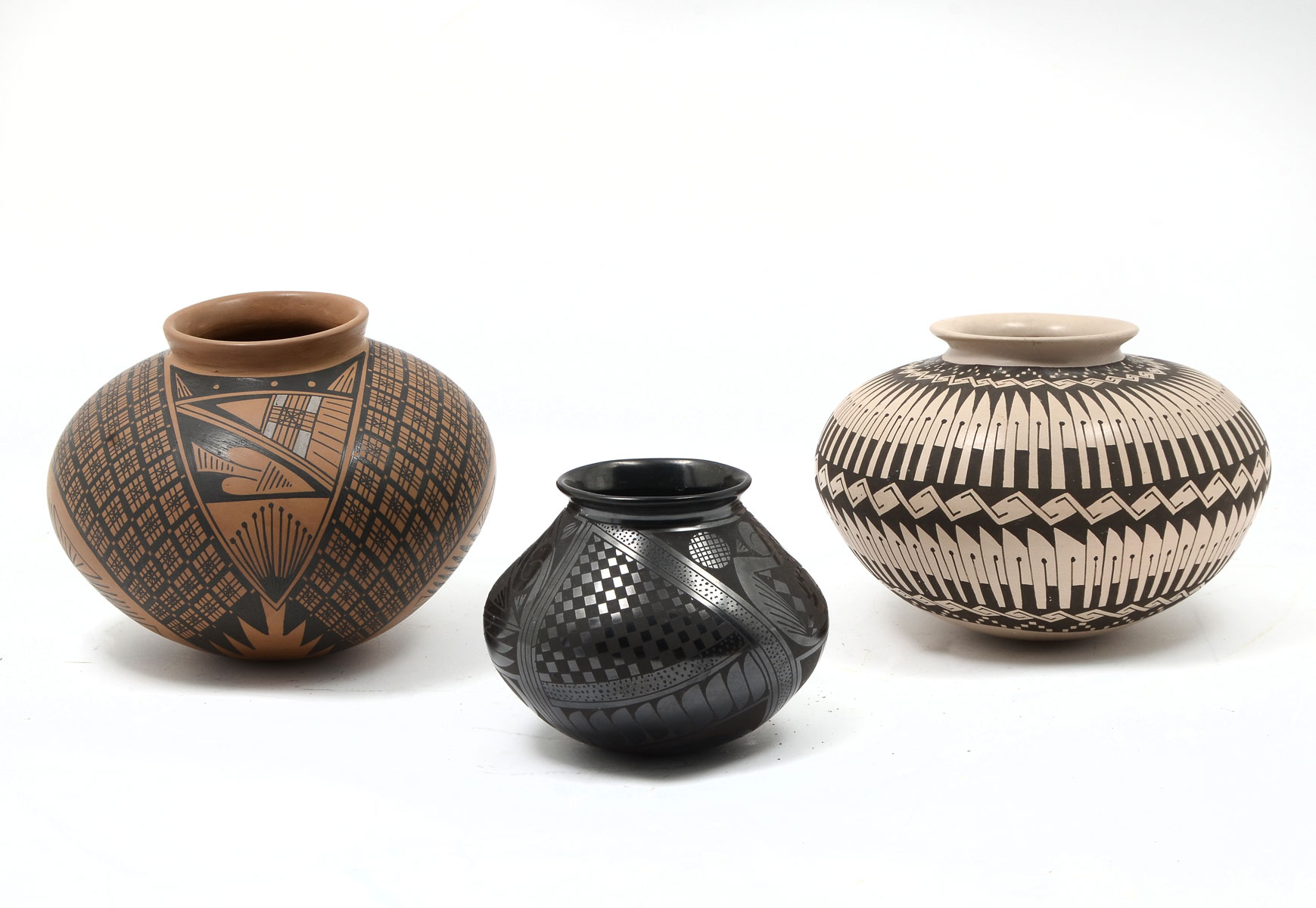 Appraisal: AMERICAN NATIVE INDIAN POTTERY VESSELS Comprising - Off-white and brown