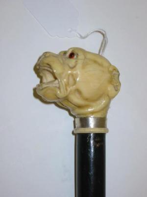 Appraisal: A VICTORIAN WALKING STICK the ivory grip carved as a