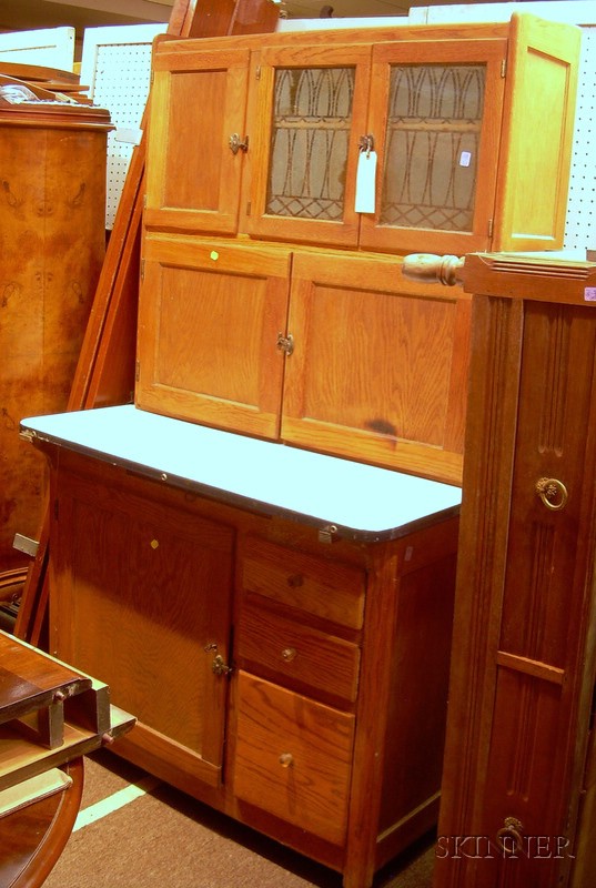 Appraisal: Oak and Porcelain-top Two-Part Hoosier Cabinet with frosted glass cabinet