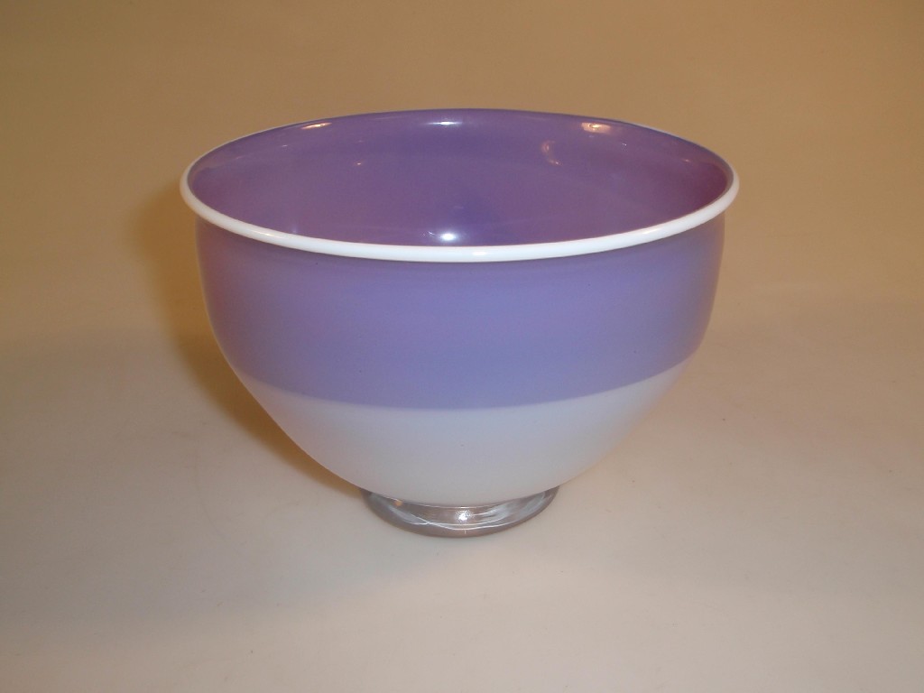 Appraisal: A Swedish art cased glass bowl with a rolled rim