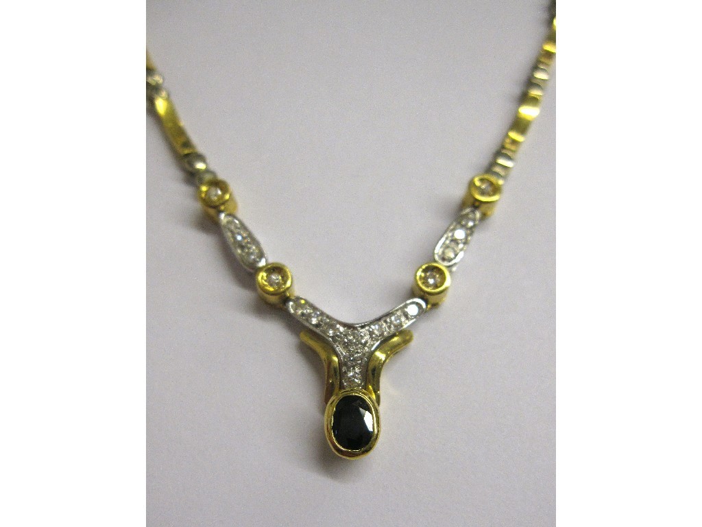 Appraisal: Eighteen carat bi colour gold sapphire and diamond set necklace