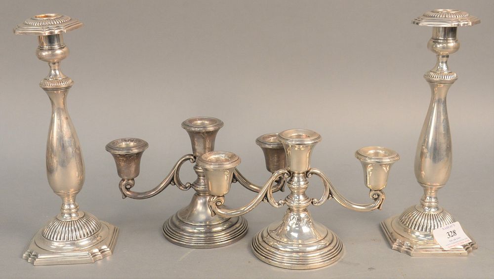 Appraisal: Four weighted sterling silver candlesticks ht in and in Four