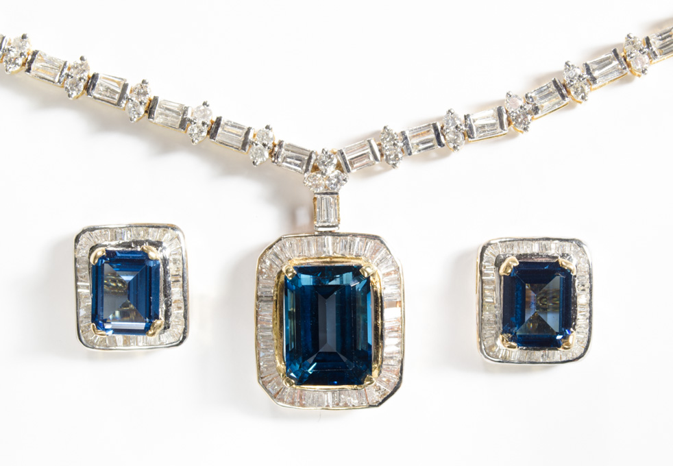 Appraisal: BLUE TOPAZ AND DIAMOND NECKLACE AND EARRING SET with black