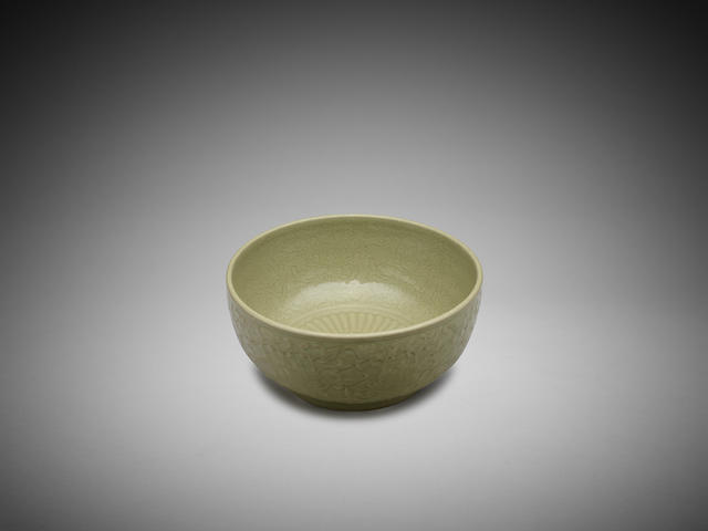 Appraisal: A Chinese moulded celadon-glaze 'lotus' bowl cm diam