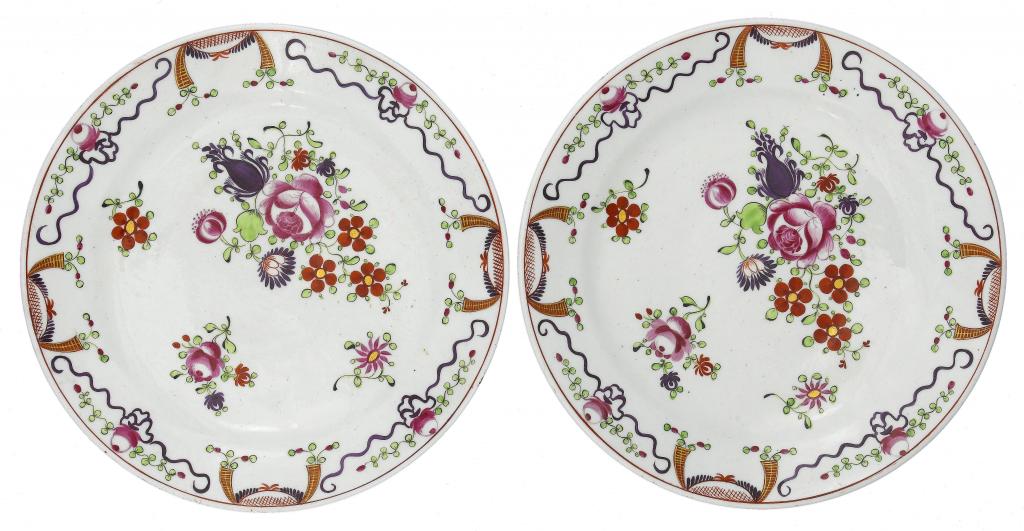 Appraisal: A PAIR OF STAFFORDSHIRE PLATES enamelled with stylised flowers in