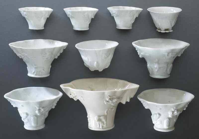 Appraisal: Chinese Qing blanc de chine libation cups shaped like rhinoceros