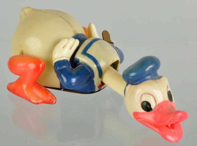 Appraisal: Celluloid Disney Crawling Donald Duck Toy Description Occupied Japanese variation