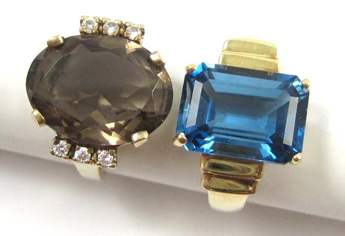 Appraisal: TWO TEN KARAT YELLOW GOLD RINGS one featuring an emerald-cut