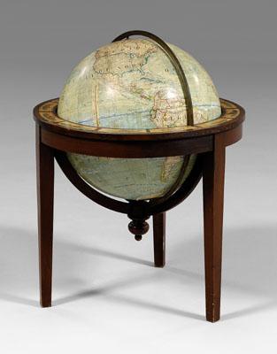 Appraisal: French terrestrial globe turning and rotating on wooden stand globe