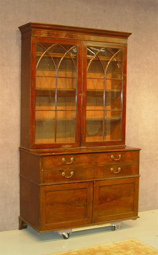 Appraisal: Mahogany Butler's Desk Bookcase Circa Two piece construction Two eleven-pane