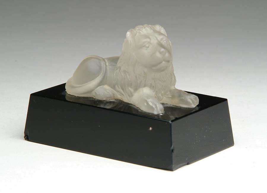 Appraisal: GLASS LION Wonderful frosted glass reclining lion rests atop a