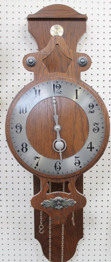 Appraisal: A modern oak cased wall clock cm