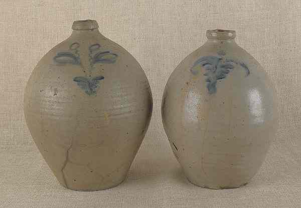 Appraisal: Two ovoid stoneware jugs th c with cobalt floral decoration