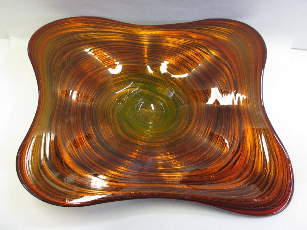 Appraisal: Heavy art glass dish with swirling red orange glitter decoration