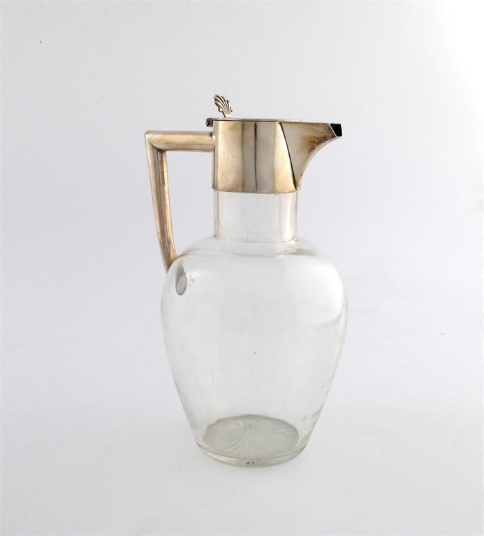 Appraisal: An electroplated mounted glass claret jug