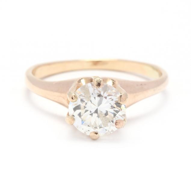 Appraisal: GOLD AND ROUND BRILLIANT CUT DIAMOND RING The round brilliant