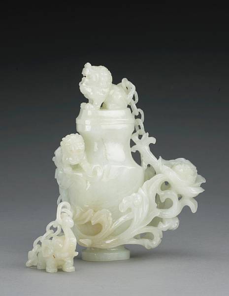 Appraisal: A carved white jade covered vase and chain group th