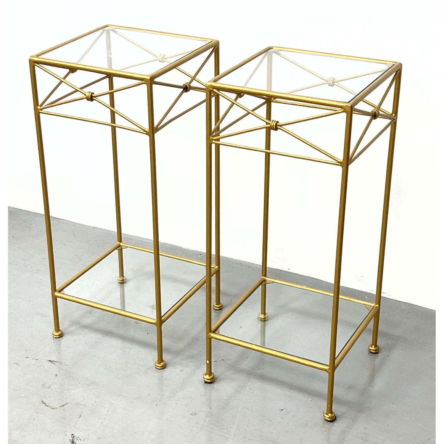 Appraisal: Pr Gold Painted Metal and Glass Stands Tall Pedestals Dimensions