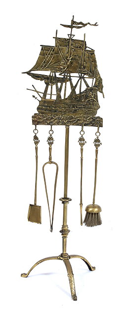 Appraisal: AN OLD CAST BRASS FIRE IRON STAND surmounted by a