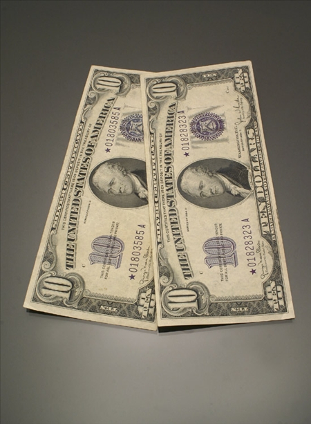 Appraisal: Two Ten-Dollar U S Silver Certificates Dated D Wide Star