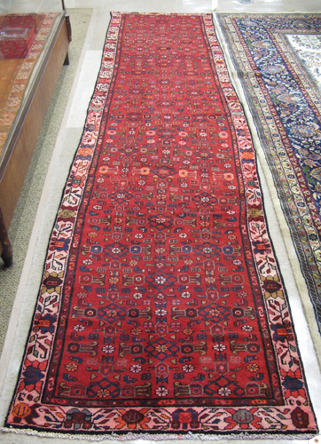 Appraisal: PERSIAN HAMADAN TRIBAL CORRIDOR CARPET overall Herati floral decoration on