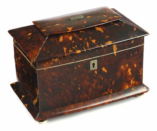 Appraisal: A George III tortoiseshell tea caddy of bowfront rectangular section