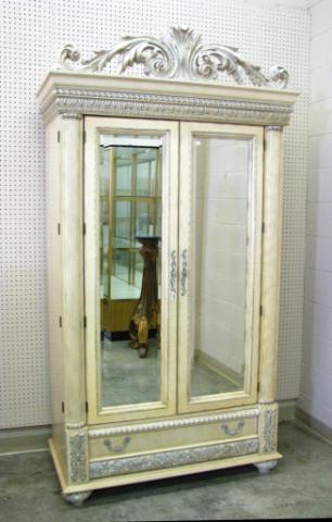 Appraisal: Neo-classical mirrored door armoire combining French and Mediterranean styles carved