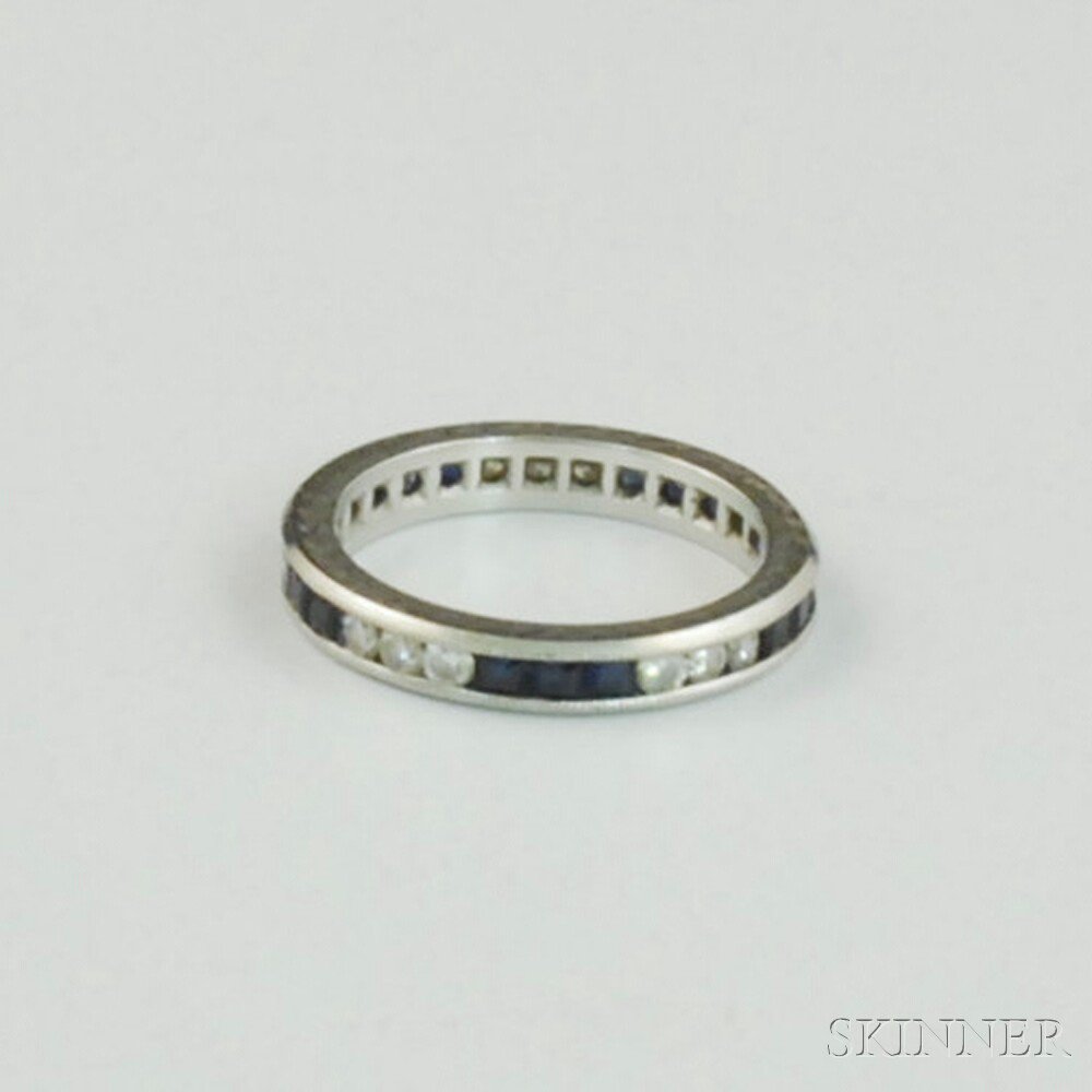 Appraisal: Platinum Sapphire and Diamond Band set with alternating full-cut diamond