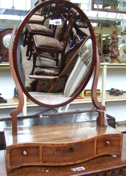 Appraisal: A th century mahogany toilet mirror the oval plate above