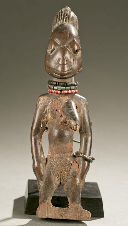 Appraisal: Yoruba female Ibeji figure th c A standing female Ibeji