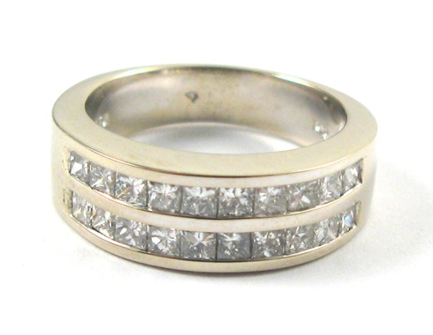 Appraisal: DIAMOND AND FOURTEEN KARAT GOLD RING The white gold band