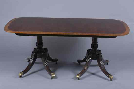 Appraisal: REGENCY STYLE MAHOGANY DOUBLE-PEDESTAL DINING TABLE Rectangular top with rounded