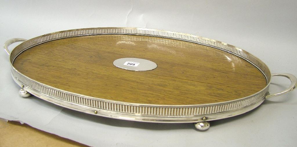 Appraisal: Oval oak and silver plated gallery tray wide