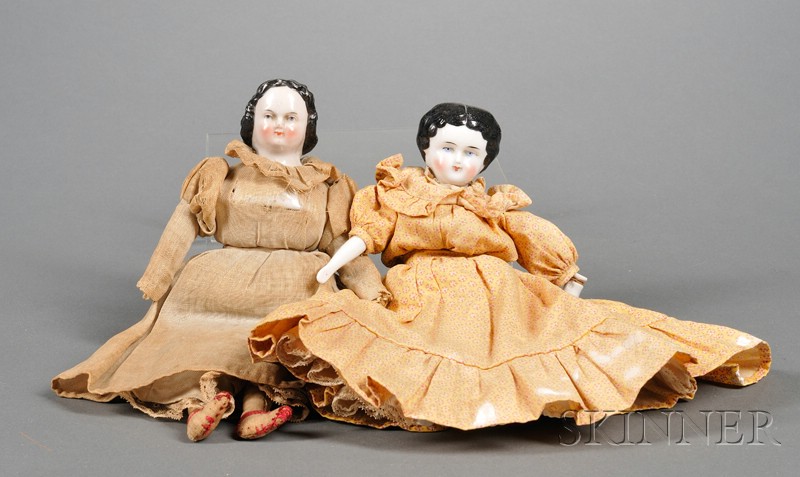 Appraisal: Two Black-Haired China Shoulder Head Dolls Germany late th century