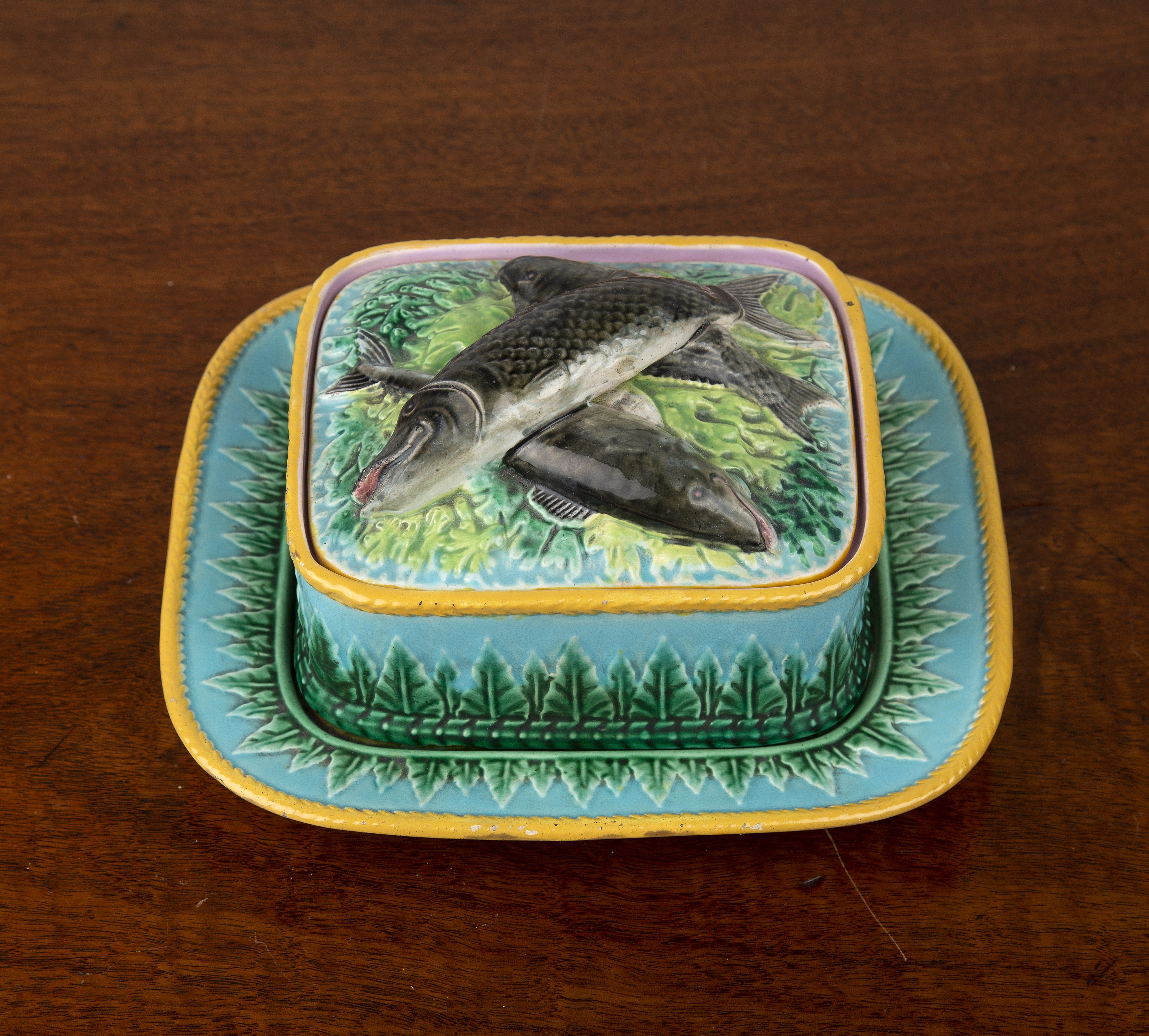 Appraisal: George Jones majolica sardine box cover and stand th Century