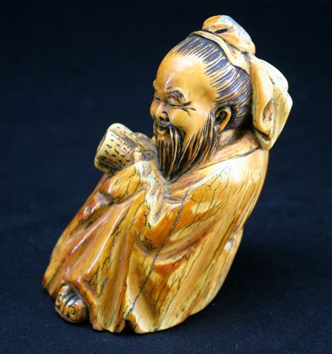 Appraisal: A Chinese ivory carving of a sage cm high