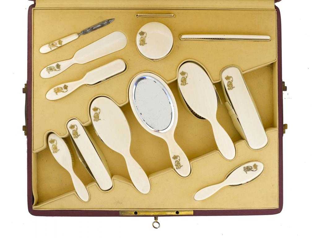 Appraisal: A CONTINENTAL IVORY BRUSH SET applied with a giltmetal crowned