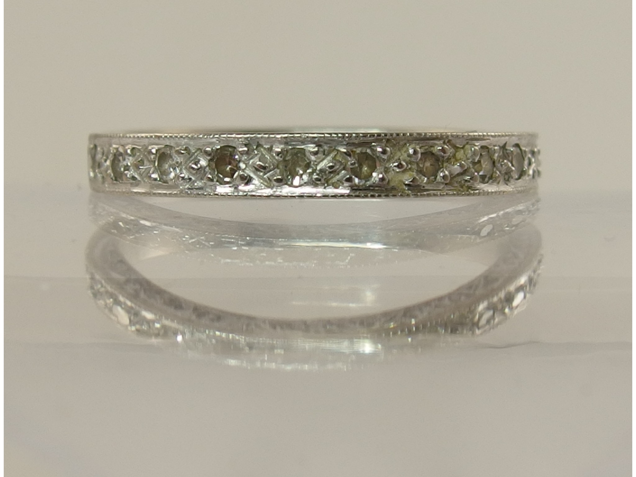 Appraisal: An ct white gold half eternity ring