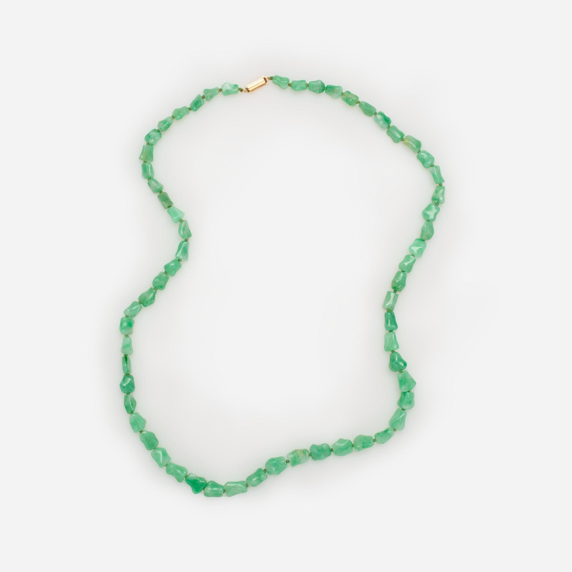 Appraisal: NEPHRITE BEAD NECKLACE WITH K CLASP LONG A necklace with