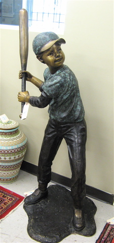 Appraisal: FIGURAL BRONZE PARK SCULPTURE the figure of a Little League