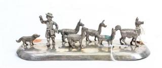 Appraisal: A Peruvian Silver Figural Group depicting a shepherd and his