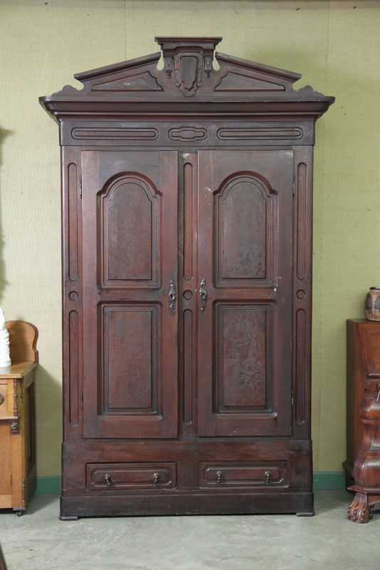 Appraisal: VICTORIAN WARDROBE Walnut knock down wardrobe having a stepped crest