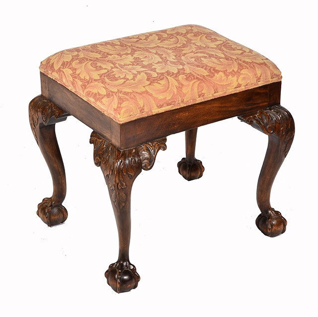 Appraisal: A CHIPPENDALE STYLE CARVED MAHOGANY DRESSING STOOL with ball and